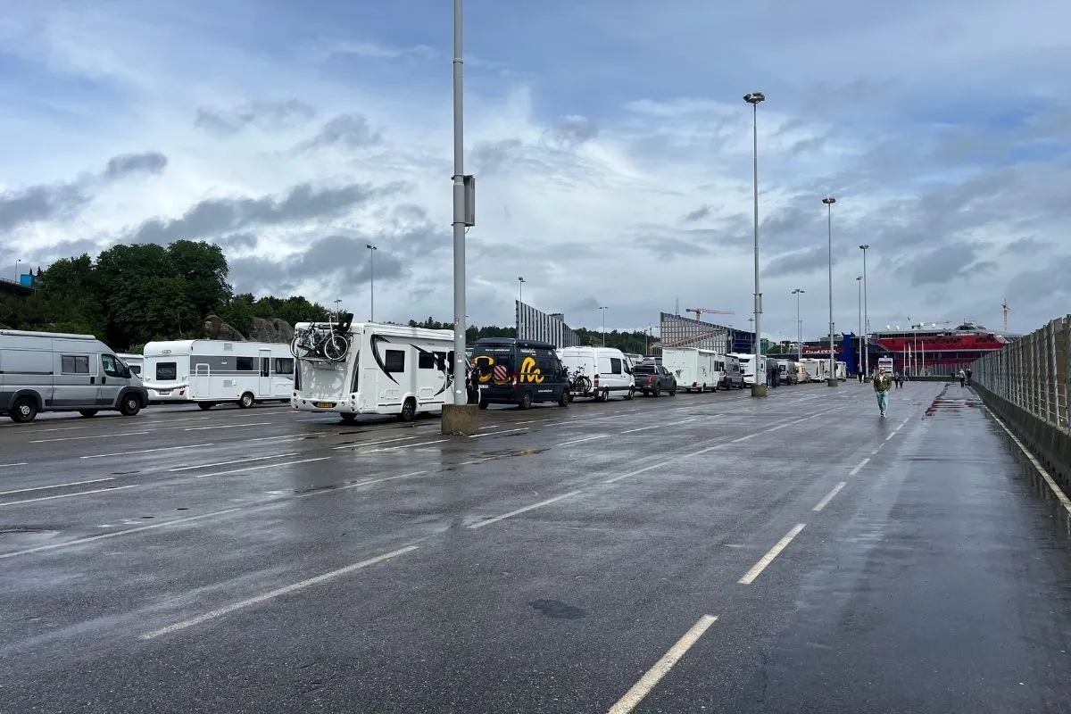 Motorhomes and cars waiting in the marshalling lanes beside the terminal